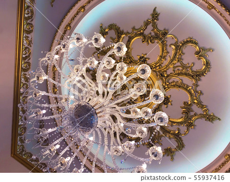 Chrystal chandelier lamp on the ceiling in Dining room Adjusting the image in a Luxury tone Chrystal chandelier lamp on the ceiling in Dining room Adjusting the image in a Luxury tone 55937416