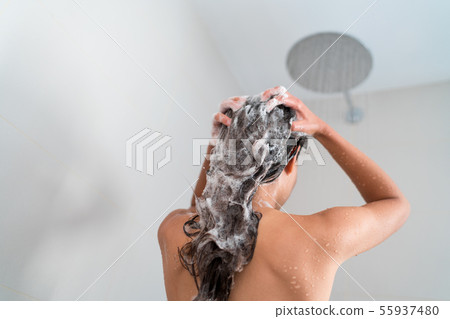 Shower woman washing hair showering in bathroom 55937480