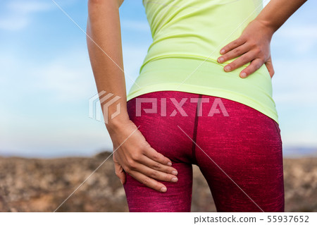 Lower back glute muscle cramp pain athlete runner 55937652