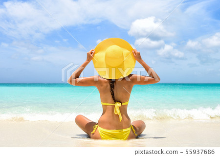 Summer beach vacation woman enjoying sun holiday 55937686