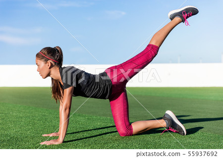 Fitness woman doing leg strength exercise workout 55937692