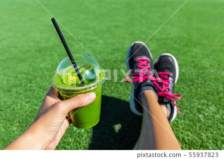 Green smoothie fitness running shoes feet selfie Green smoothie fitness running shoes feet selfie 55937823