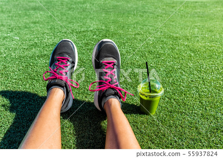 Healthy lifestyle green smoothie runner feet selfie Healthy lifestyle green smoothie runner feet selfie 55937824