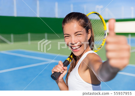 Happy Asian tennis player girl thumbs up game fun 55937955