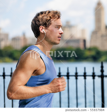 Man runner running listening to wireless earphones 55937984