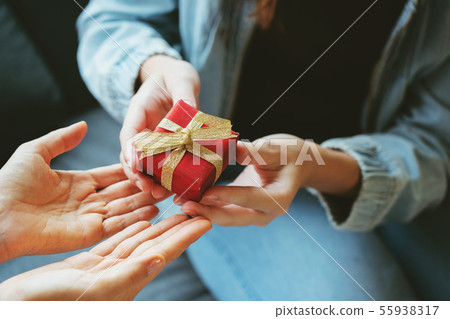 Giving gift box in festivals, Christmas, New Year Giving gift box in festivals, Christmas, New Year 55938317