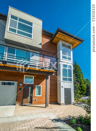Brand new townhouse building on sunny day in British Columbia. Brand new townhouse building on sunny day in British Columbia. 55938320