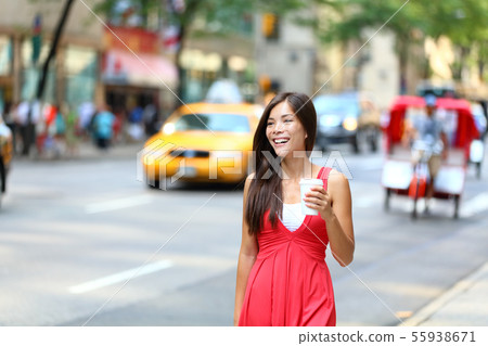 Casual young urban woman drinking coffee New York Casual young urban woman drinking coffee New York 55938671