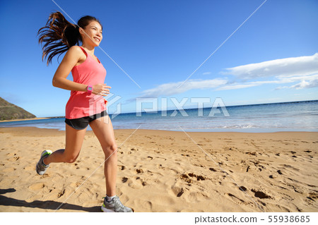 Sports athlete runner running woman on beach 55938685