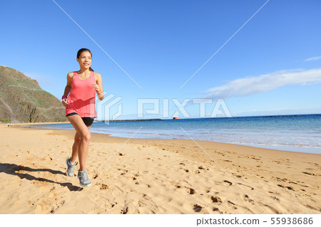 Jogging sports athlete runner woman on beach Jogging sports athlete runner woman on beach 55938686