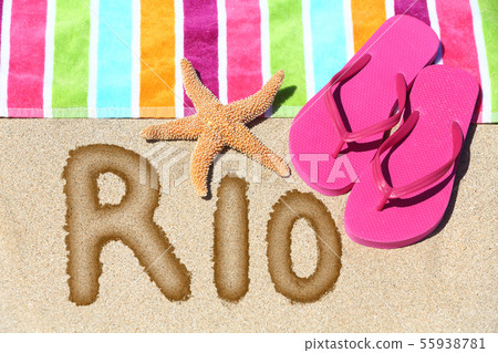 Rio beach vacation concept - flip flops and towel Rio beach vacation concept - flip flops and towel 55938781