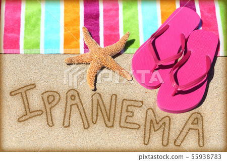 Ipanema beach vacation concept - sand and towel 55938783