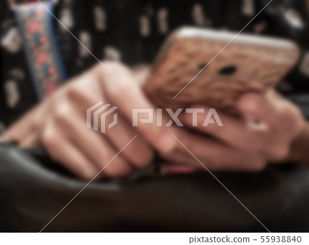 Blur image-selected at women hands  use cellphone 55938840