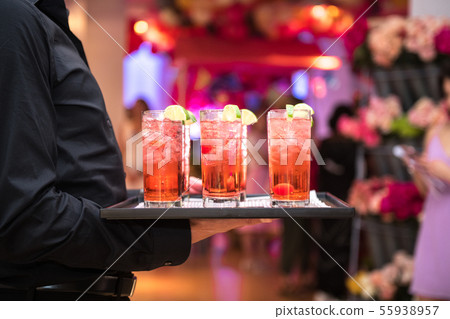 Refreshing alcohol red cocktails with ice 55938957