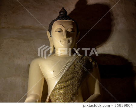 light and shadow of white buddha statue in temple 55939004