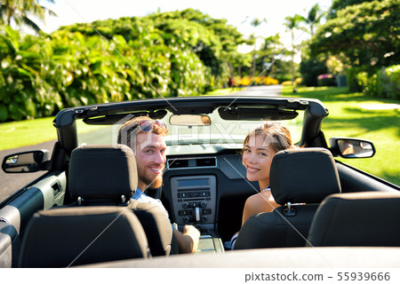 Happy couple in car on summer road trip travel 55939666
