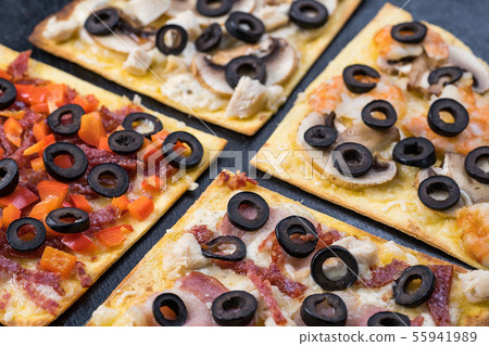 Assorted pizza slices. Margherita, pepperoni, four cheese pizza. Top view. Different types of pizza 55941989