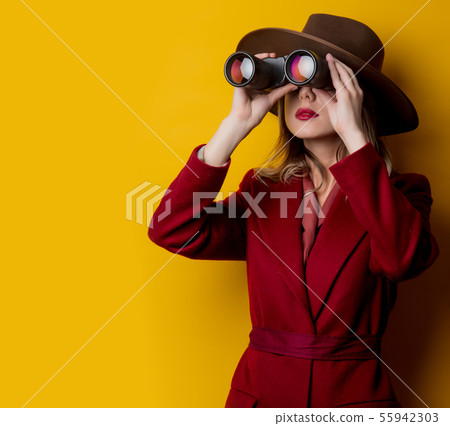 Woman in 1940s style clothes and binoculars Woman in 1940s style clothes and binoculars 55942303