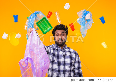 Environmental pollution, plastic recycling problem and waste disposal concept - surprised indian man Environmental pollution, plastic recycling problem and waste disposal concept - surprised indian man 55942478