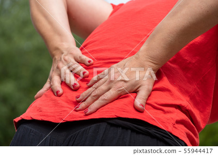 Woman suffering from backache. Office Syndrome 55944417