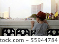 a boy stands with his back on the river. 55944784