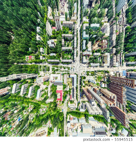 Aerial city view with crossroads and roads, houses, buildings, parks and parking lots. Sunny summer 55945515