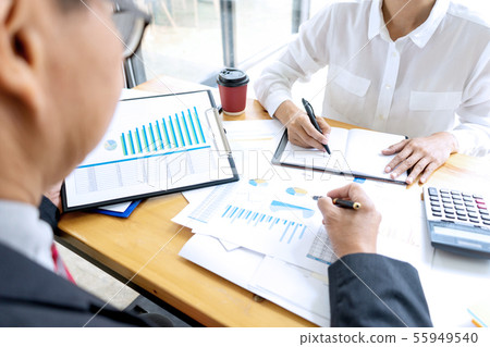 Businessman coaching office staff Businessman coaching office staff 55949540