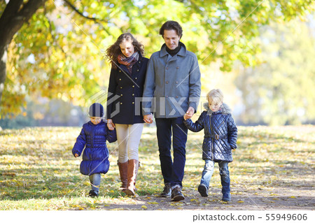 Family walk in autumn park Family walk in autumn park 55949606