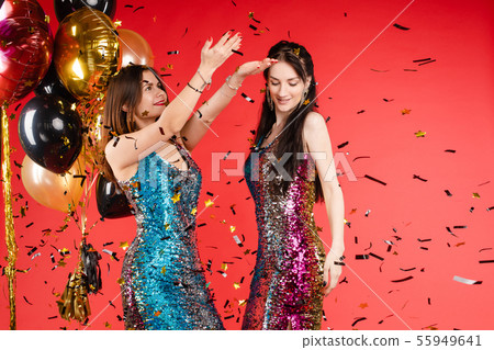 Group smiling woman posing surrounded by colorful Group smiling woman posing surrounded by colorful 55949641
