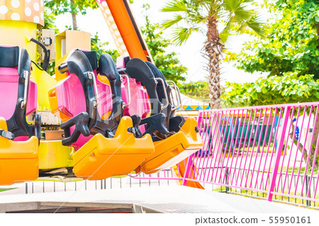 Colorful roller coaster seats at amusement park Colorful roller coaster seats at amusement park 55950161