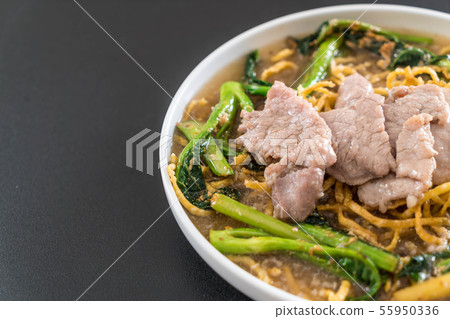 crispy egg noodles with chinese broccoli and pork 55950336