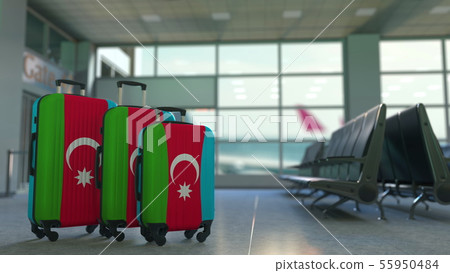 Travel suitcases with flag of Azerbaijan. Azerbaijani tourism conceptual 3D rendering Travel suitcases with flag of Azerbaijan. Azerbaijani tourism conceptual 3D rendering 55950484