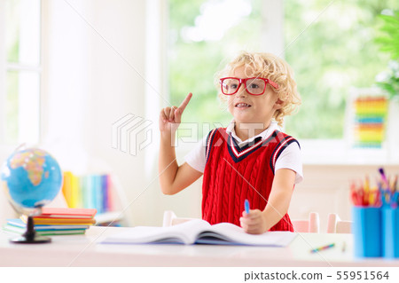 Kids doing homework. Children go back to school. Kids doing homework. Children go back to school. 55951564