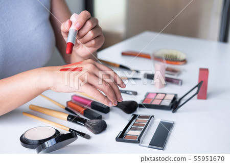 Elegant female Beauty blogger showing testing 55951670