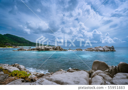 Tropical island landscape of beautiful beach with impressive clouds, Anse Marron, La Digue 55951883