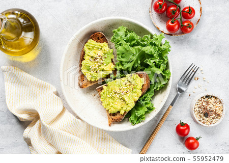 Healthy Vegan Avocado Toast And Kale Salad With Olive Oil Healthy Vegan Avocado Toast And Kale Salad With Olive Oil 55952479