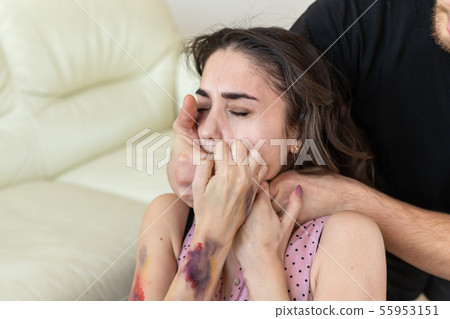 Victim, abuse and domestic violence - cruel man strangling his wife Victim, abuse and domestic violence - cruel man strangling his wife 55953151