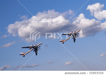 Two propeller airplanes on clear blue sky 55955554