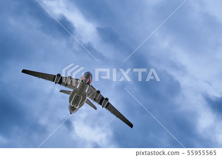 Heavy airlifter plane upshot on cloudy sky 55955565