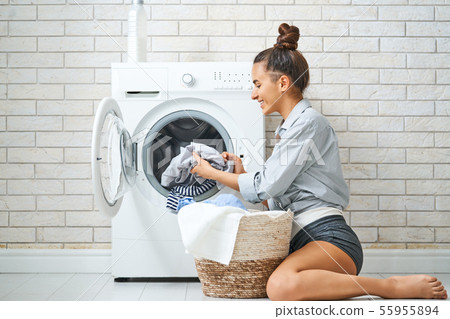 woman is doing laundry woman is doing laundry 55955894
