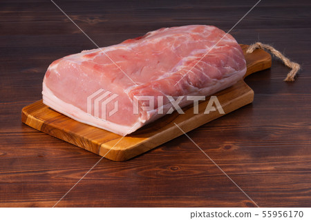 Raw pork on cutting board. clouse up Raw pork on cutting board. clouse up 55956170