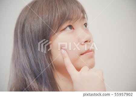 Women who touch skin with fingers Women who touch skin with fingers 55957902