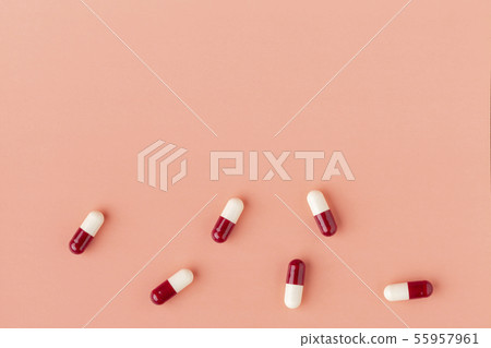 Scattering of red and white drug capsules Scattering of red and white drug capsules 55957961