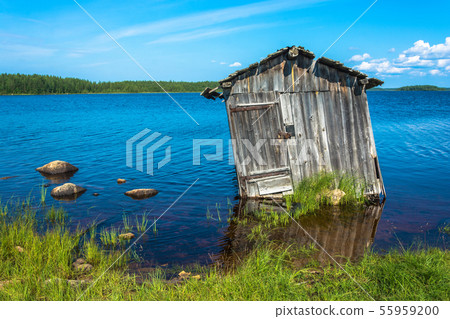 Old barn by the lake. Old barn by the lake. 55959200