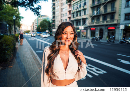 portrait of young stylish asian girl on the street of big modern city 55959515