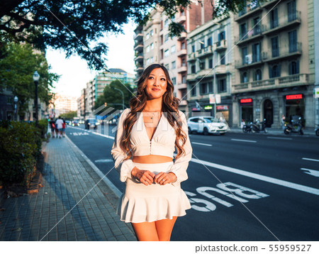 portrait of young stylish asian girl on the street of big modern city portrait of young stylish asian girl on the street of big modern city 55959527