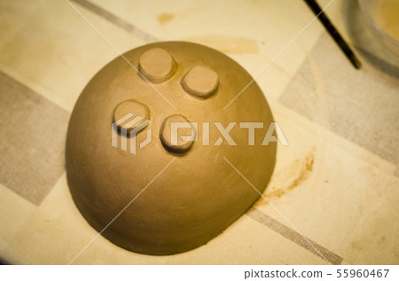 Plate made of clay. Hand made. Hobby. Plate made of clay. Hand made. Hobby. 55960467