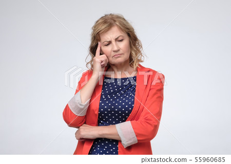 Mature sad woman thinking about something. Studio shot 55960685