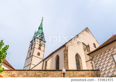 Spiky tower of Church of the Assumption of the Virgin Mary in Jindrichuv Hradec, Czech Republic Spiky tower of Church of the Assumption of the Virgin Mary in Jindrichuv Hradec, Czech Republic 55961455