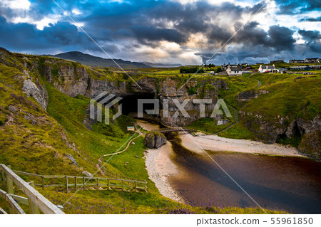 Entrance And Bridge To Smoo Cave In Scotland 55961850